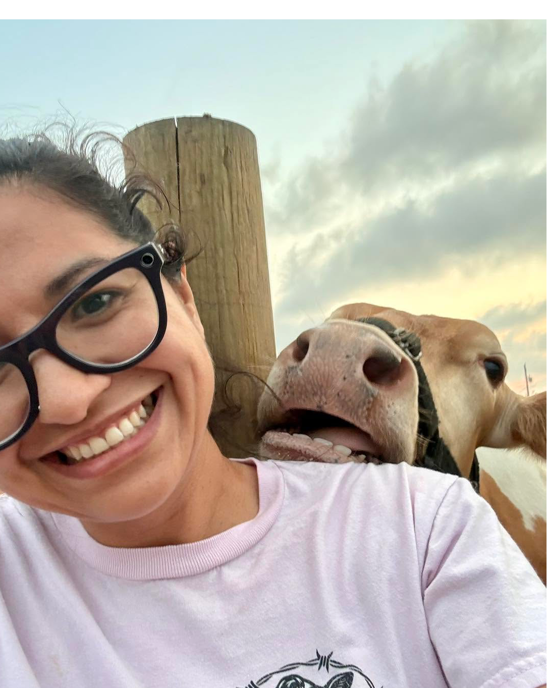 Amber with one of the farm's cows